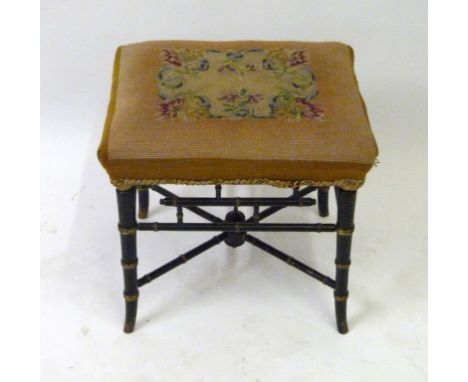 A Victorian faux bamboo framed stoolOf rectangular form, with floral tapestry top, width 45cm.