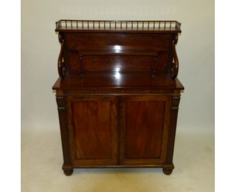 A William IV mahogany Chiffonier With galleried top shelf, on scroll supports, over a smaller shelf and the base with two pan