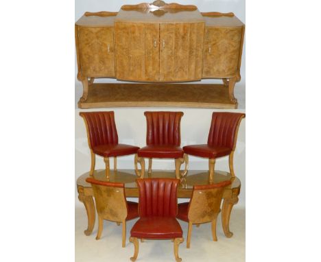 A fine Art Deco birdseye maple Epstein dining suiteComprising refectory table, raised on four outswept supports with carved k