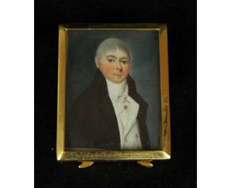 A portrait miniature depicting a Georgian gentlemanWearing a black jacket, inset within later gilt frame, 5x4cm