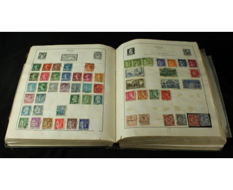 A 'The Strand' green stamp albumContaining mint and used pre-1950 stamps of the world including some good GB and Commonwealth