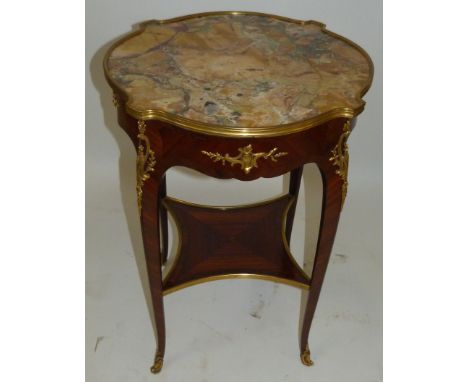 A small French occasional tableWith gilt metal mounts and coloured marble top with shelf beneath, raised on four swept legs, 