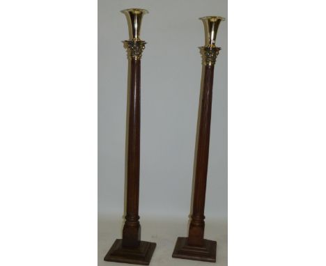 A pair of 19th Century ecclesiastical style oak and brass mounted floor standing combination vase/candlestick With removable 