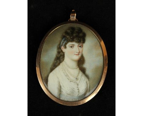 A 19th Century portrait miniature on ivory Depicting a girl with black curly hair wearing a pearl necklace, inset within oval