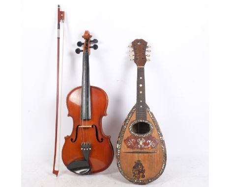 A full-size violin, with a paper label for Antonio Stradivarius, numbers on the label are rubbed out, back length 14", with s