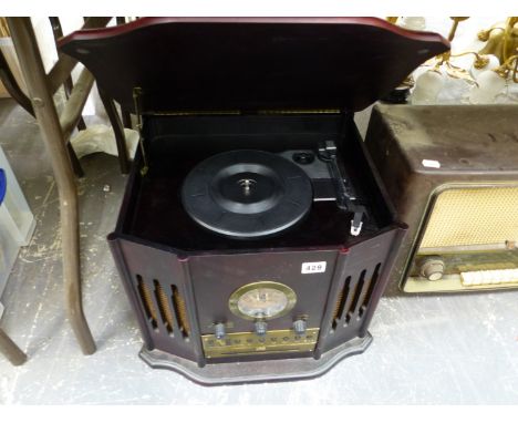 A VINTAGE BAKELITE PHILLIPS RADIO, TOGETHER WITH A VINTAGE STYLED CD AND RECORD PLAYER TUNER.