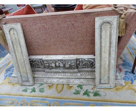 A GEORGE III WHITE PAINTED FIRE SURROUND, EGG AND DART AND DENTIL BANDS BELOW THE SHELF AND ABOVE SCROLLING FOLIAGE FLANKING 