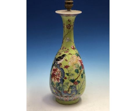 A CHINESE GREEN GROUND BALUSTER VASE AS A LAMP, THE BODY PAINTED WITH A MAGPIE AMONGST FLOWERS IN FAMILLE ROSE ENAMELS.   H 3