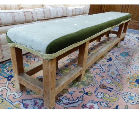 A GEORGIAN STYLE TWO TONE GREEN UPHOLSTERED BENCH, THE SQUARE SECTIONED LEGS AND CONJOINING STRETCHERS COVERED IN PALE BROWN 