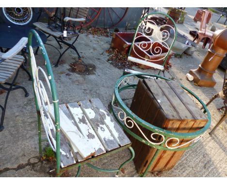 WROUGHT IRON GARDEN TABLE AND THREE MATCHING CHAIRS AND A WOODEN CRATE 
