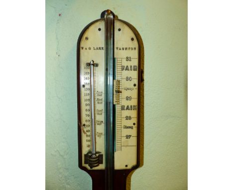 T &amp; C LAKE TAUNTON, A ROSEWOOD STICK BAROMETER, THE IVORY SCALE FLANKED BY A MERCURY THERMOMETER, THE GLASS TUBE SHOWING 