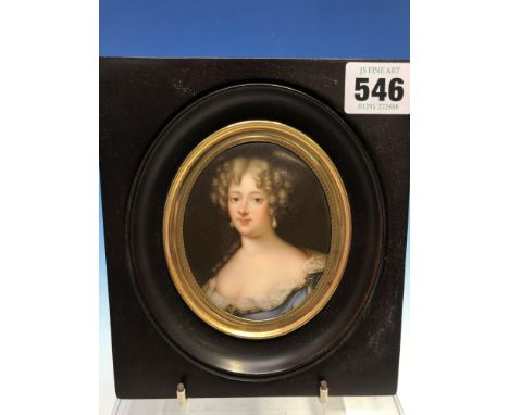 A PORTRAIT MINIATURE ON PORCELAIN DEPICTING LOUISE DE LA VALLIERE IN A BLACK WOOD FRAME. 16 x 14cms.