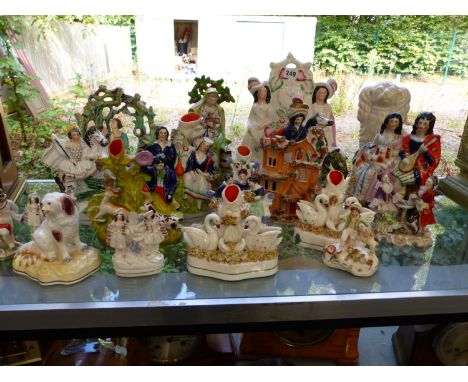 A LARGE QUANTITY OF STAFFORDSHIRE FLAT BACK FIGURINE GROUPS