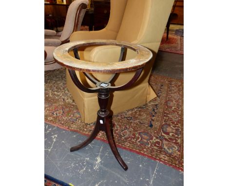 A GEORGE III MAHOGANY TRIPOD GLOBE STAND, THE RIM PRINTED AND PAINTED WITH THE MONTHS AND STAR SIGNS OF THE YEAR.   Dia. 43 x