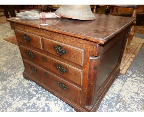 AN 18th C. OAK COFFER, THE FRONT WITH TWO FALSE SHORT AND TWO LONG DRAWERS ABOVE BRACKET FEET.   W 65 x D 51 x H 47cms.