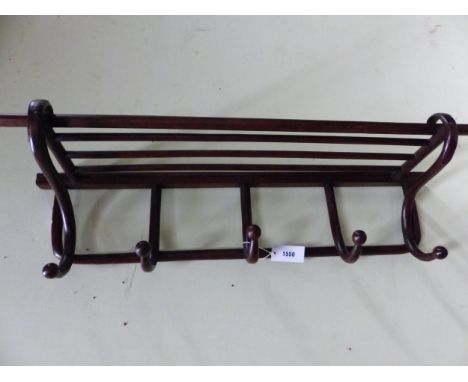A WALL HANGING BENT WOOD HAT AND FIVE HOOK CLOAK RACK.   W 90cms.