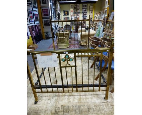 A BRASS DOUBLE BED, THE ENDS CENTRED BY RUSKIN TYPE TURQUOISE CERAMIC TREFOILS, ROUNDELS AT THE TOPS OF THE SQUARE SECTIONED 