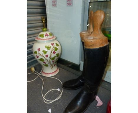 A PAIR OF RIDING BOOTS AND A LARGE TABLE LAMP