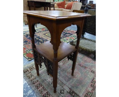A MAHOGANY TWO TIER TABLE, AN OGEE BRACKET APRON TO THE UPPER TIER AND MISHRABIYE TO THE LOWER, THE SQUARE SECTION LEGS ON CY