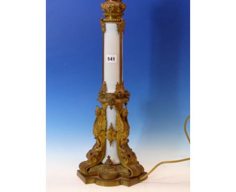 AN ORMOLU MOUNTED OPALINE GLASS COLUMNAR TABLE LAMP, THE SOCKET ABOVE A GADROONED BUN WITH VINE LEAVES, THREE STRAPS BETWEEN 