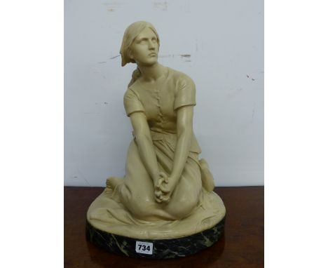 R CHAPU, AN EARLY 20th C. CREAM PAINTED TERRACOTTA FIGURE OF A SEATED LADY, BELIEVED TO JOAN OF ARC, HER HANDS CLASPED IN HER