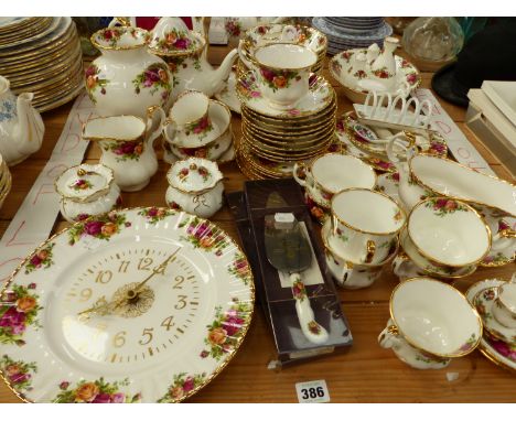 A OLD COUNTRY ROSES ROYAL ALBERT PART TEA AND DINNER SERVICE, TO INCLUDE A CLOCK AND FRAME, ETC