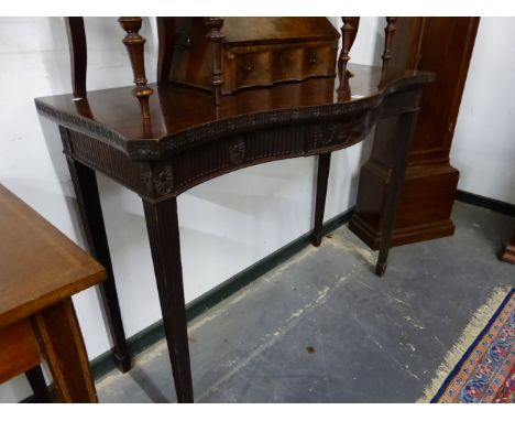 A LATE 19th C. MAHOGANY CONSOLE TABLE, THE SERPENTINE FRONT EDGE AND THE SIDES WITH FLUTE AND FLOWER HEAD BAND, A SWAGGED URN