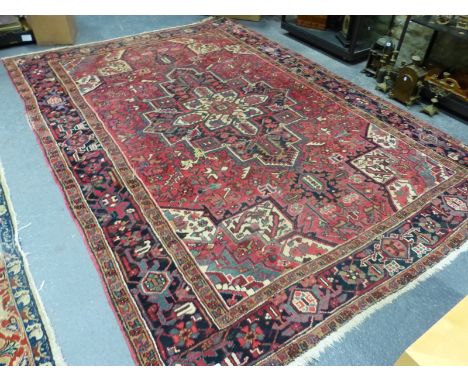 A PERSIAN HERIZ CARPET, 335 x 242cms