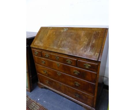 A GEORGE III HERRING BONE BANDED WALNUT BUREAU, THE FALL ABOVE THREE SHORT DRAWERS AND THREE LONG DRAWERS ON BRACKET FEET.   