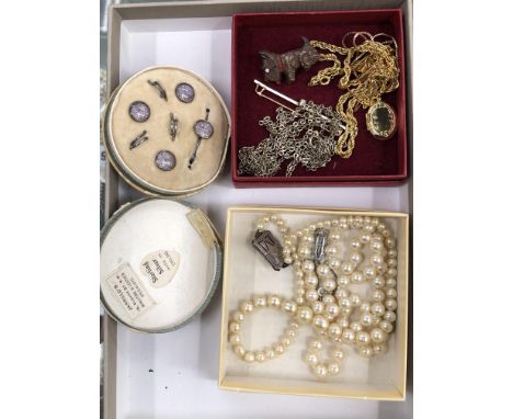 A CASED SET OF SILVER AND ENAMEL DRESS STUDS, TOGETHER WITH A STRING OF PEARLS WITH A PASTE AND SILVER CLASP, PLATED CHAINS E