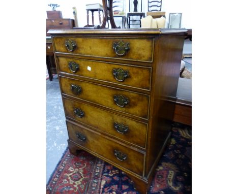 A BURR ELM CHEST OF FIVE GRADED DRAWERS ON BRACKET FEET.   W 63 x D 47 x H 86cms.