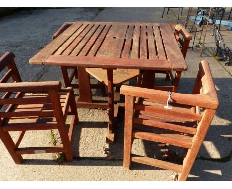 A LISTER GARDEN TABLE AND FOUR CHAIRS