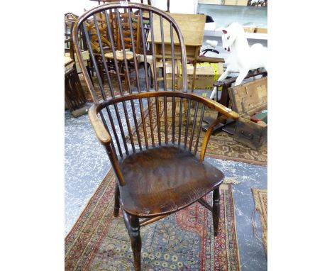 AN ANTIQUE WINDSOR CHAIR WITH NINE STICK BACK, SADDLE SEAT AND BALUSTER TURNED FRONT LEGS