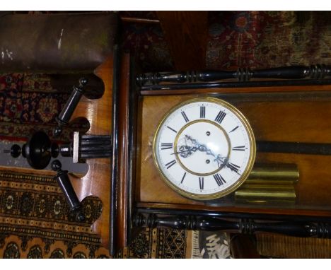 A VIENNA REGULATOR STRIKING ON A COILED ROD, THE ENAMEL DIAL WITH SUBSIDIARY SECONDS HOUSED IN A GLAZED ROSEWOOD CASE WITH EB