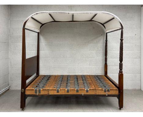 A 19th century mahogany four poster campaign bed with carved and turned supports. (Separates into six main parts as seen). H.