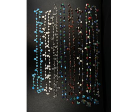 A collection of eight vintage French cut glass teardrop necklaces with three pairs of matching earrings. L.75cm 