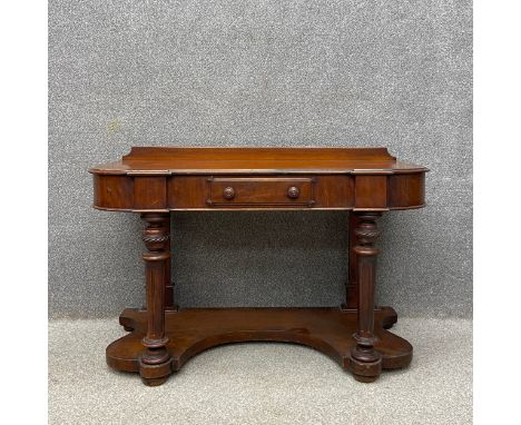 A Victorian mahogany duchess table or dresser  having a shaped and moulded top with a shallow gallery back over a crossbanded