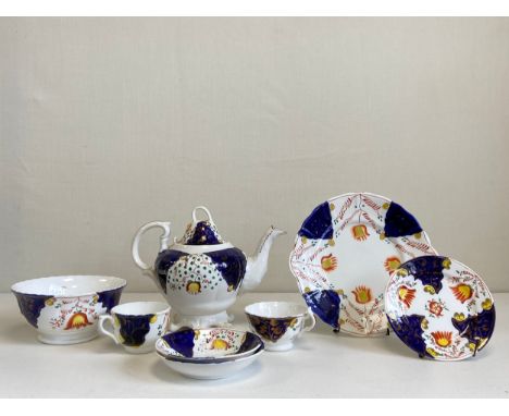 A collection of 19th century Gaudy Welsh tulip pattern porcelain to include a lidded teapot, two tea cups and saucers, two di