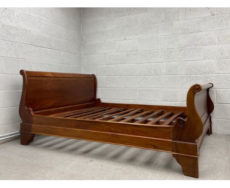 A contemporary mahogany sleigh style bedstead. Fits UK super king mattress 70.9" x 78.7" (inches) / 6'0" x 6'6" (feet)