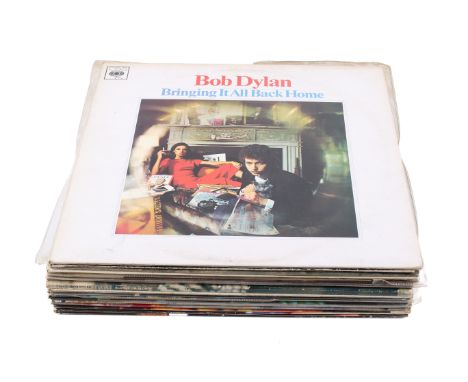 A collection of vintage Bob Dylan vinyl LP records. Including Bringing It Back Home, Real Live and Greatest Hits, etc. 