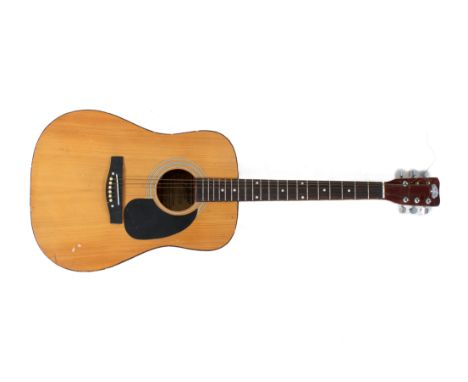 A vintage Tanglewood TW300 acoustic guitar.  