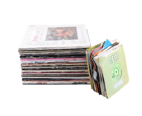 A collection of assorted vinyl records mostly 1970's and 80's pop. Including LPs and 7 inch singles from Elton John, Michael 