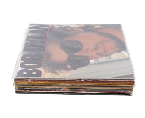 A collection of eleven assorted Bob Dylan vinyl LP records. Including Infidels, Before The Flood and The Basement Tapes, etc.