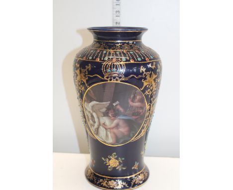 A hand decorated vase with transfer print 