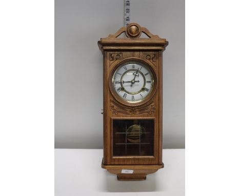 A quality light oak cased wall clock a/f postage unavailable 