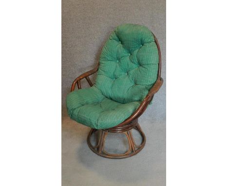A vintage cane conservatory tub chair. H.102cm 