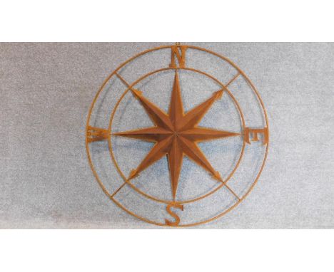 A large decorative metal compass. 104x104cm 