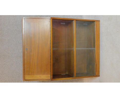 A vintage teak bureau with fitted interior and sliding glass front doors. 100x76x26cm 