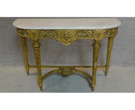 A carved giltwood marble topped console table in the Louis XVI style. 80x122x44cm 