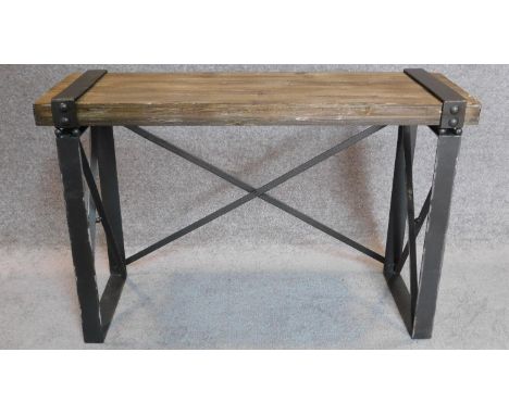 An industrial style metal framed bench with planked top. 62x94x31cm 